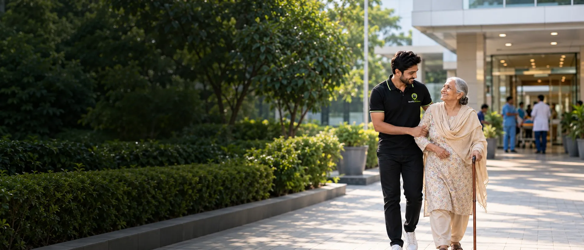 A Shadow Partner and an older woman walking together and laughing on a hospital path